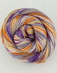 Multicolored skein of yarn on a light gray background