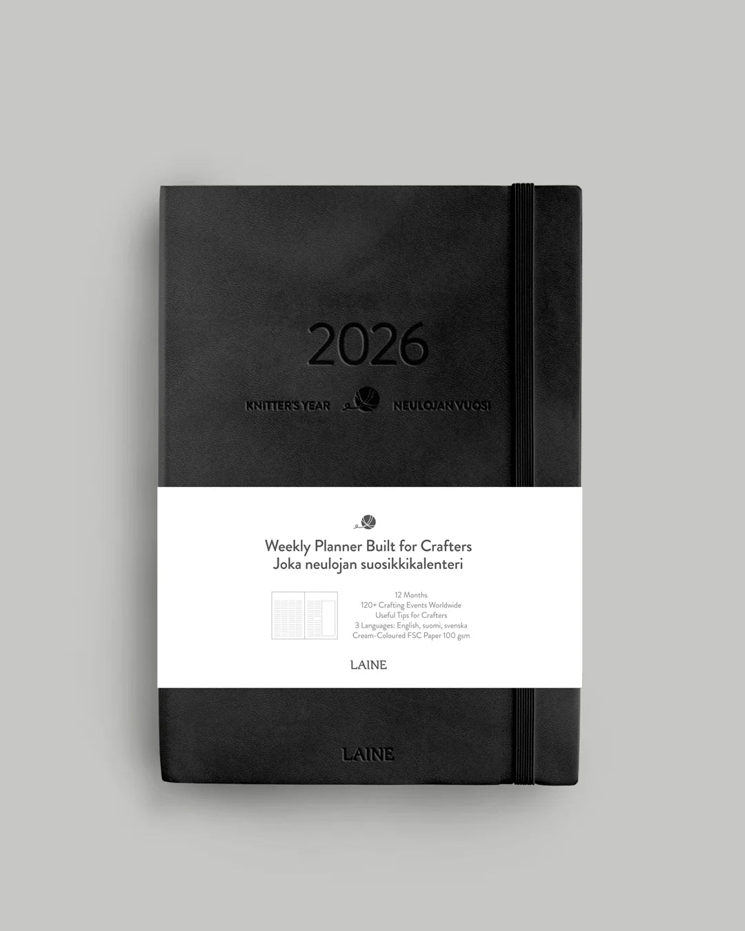 Black weekly knitting planner with '2026' on a gray background