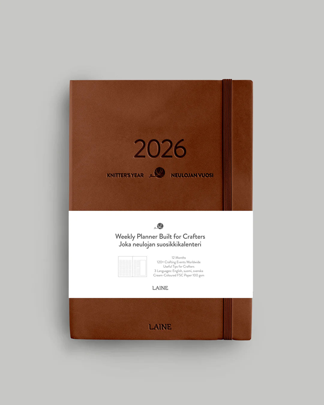 Brown weekly knitting planner with '2026' on a gray background