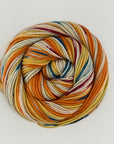 Multicolored skein of yarn on a white background