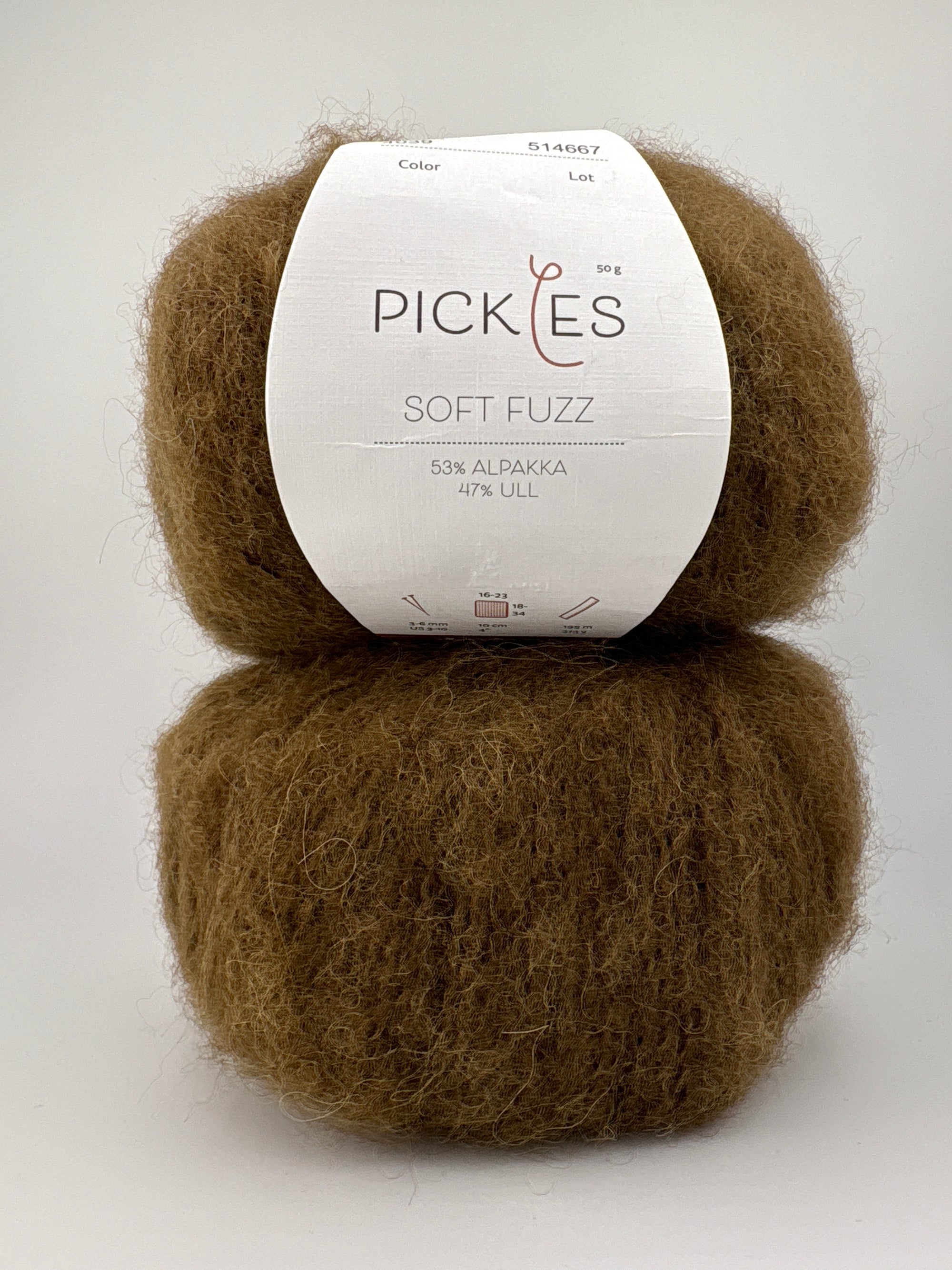 Two skeins of olive yarn with a Pickles label on a white background