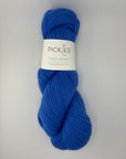 Blue skein of yarn with a Pickles label on a gray background