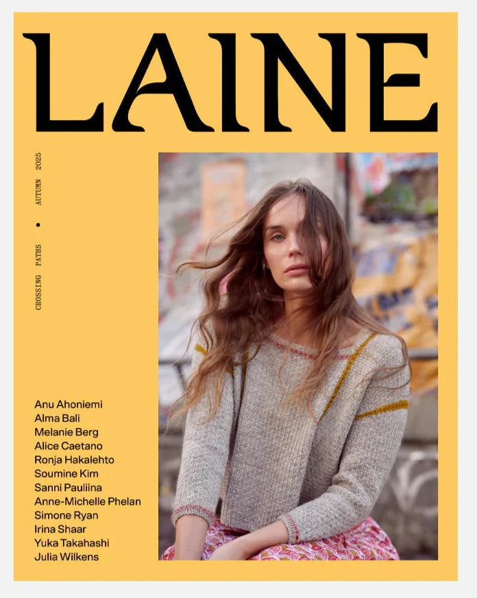 Cover of Laine magazine with a woman wearing a knitted sweater.